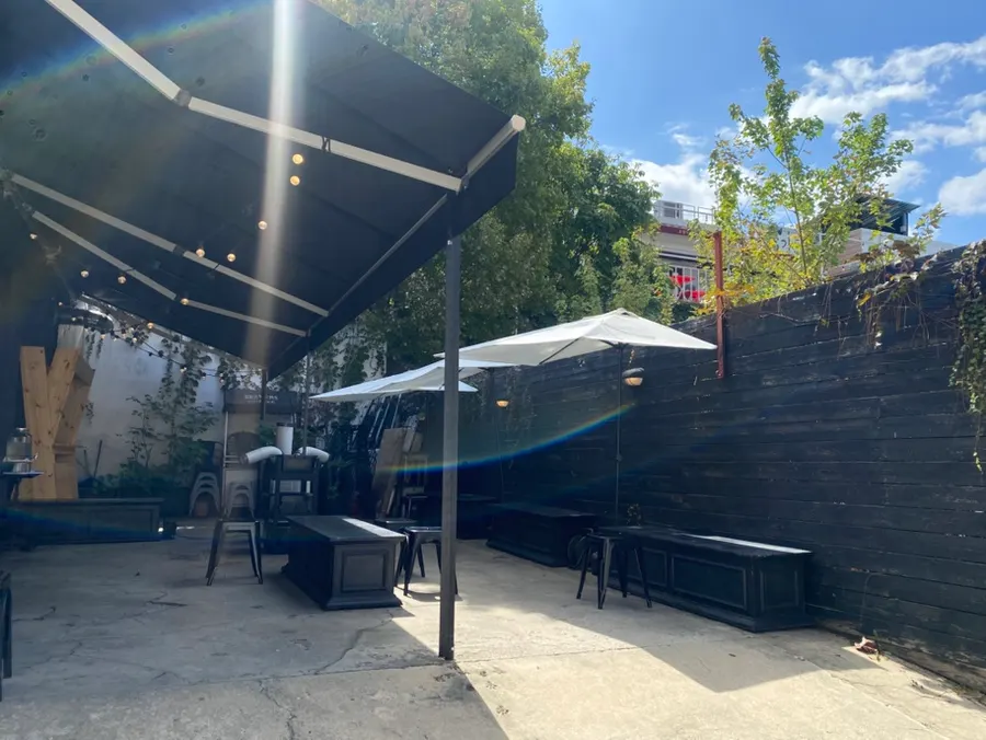 Exterior and outdoor tables of Brewers Coffee Cheonan Sinbu Branch on a sunny day