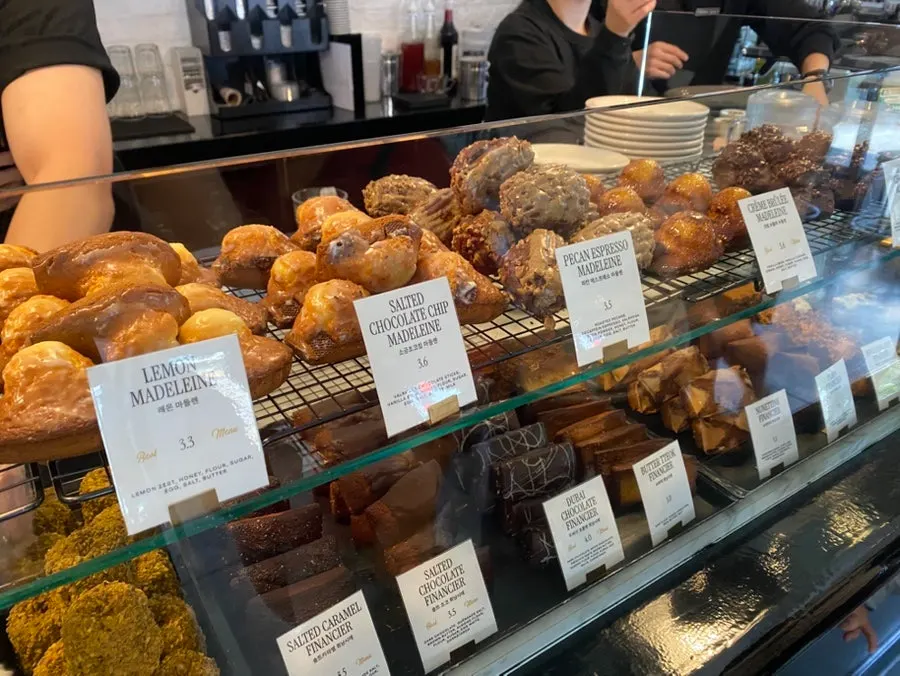 Canelé and baked pastries arranged on display