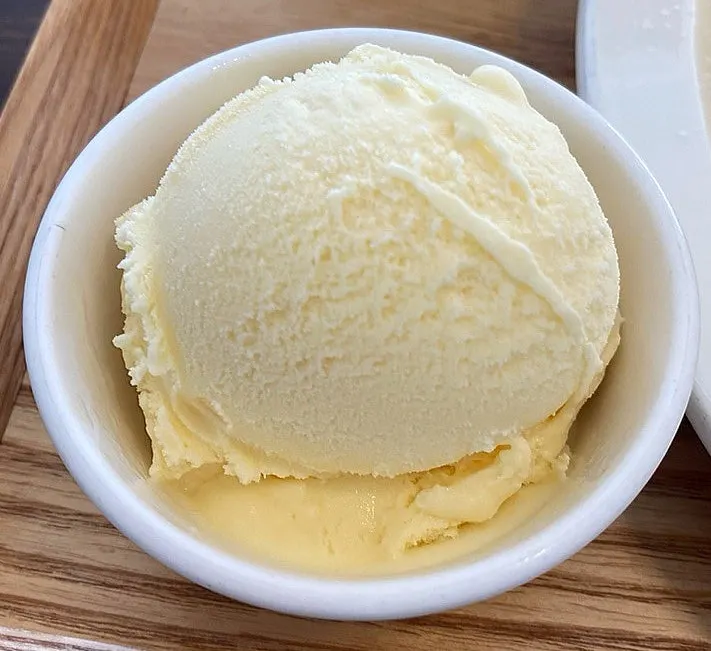 Chewy vanilla ice cream stretching as it's scooped