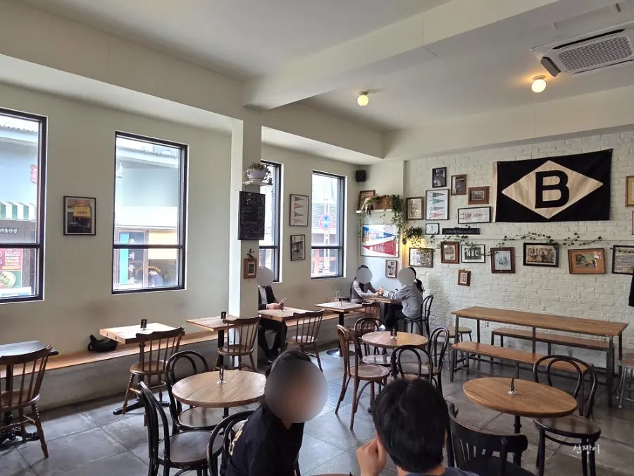 Wood tables and indirect lighting inside the café