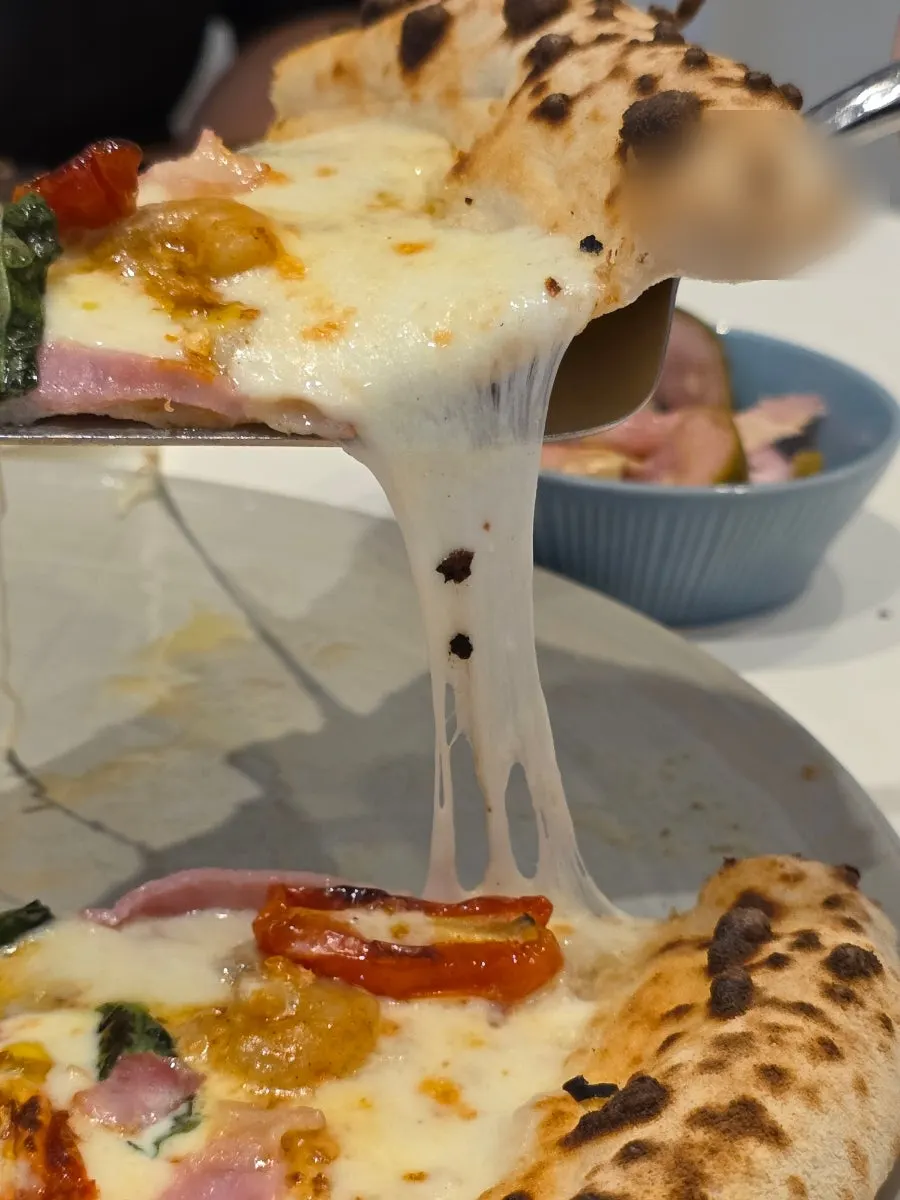 Edge of the oak-fired pizza dough at Napoli Shinbu