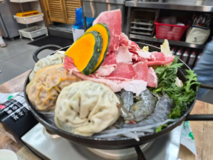 Hot pot with dumplings and meat