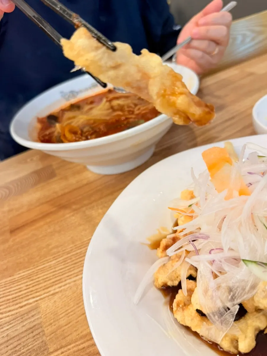 Crispy sweet-and-sour pork dipped in sauce