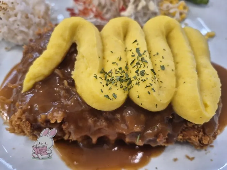 A plate of sweet-potato cheese pork cutlet