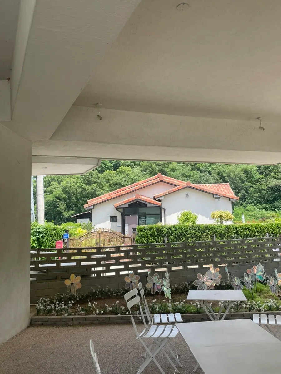 Interior with floor-to-ceiling windows and floor seating