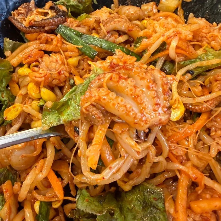 A spoonful of mixed octopus rice bowl