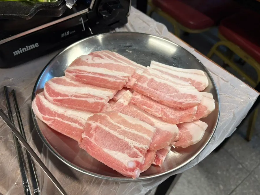 A plate with three servings of frozen pork belly