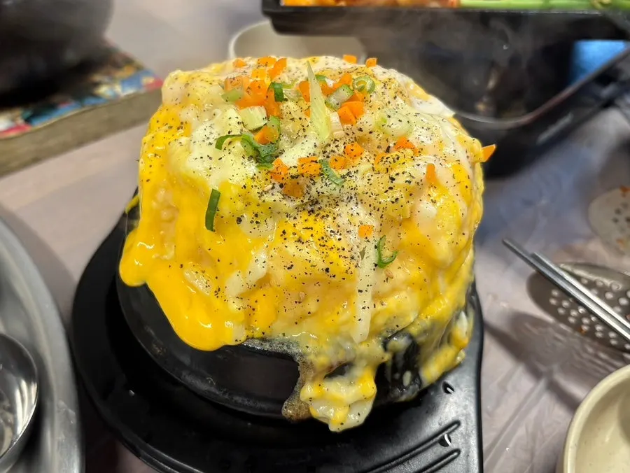Dirty egg steam topped with cheese
