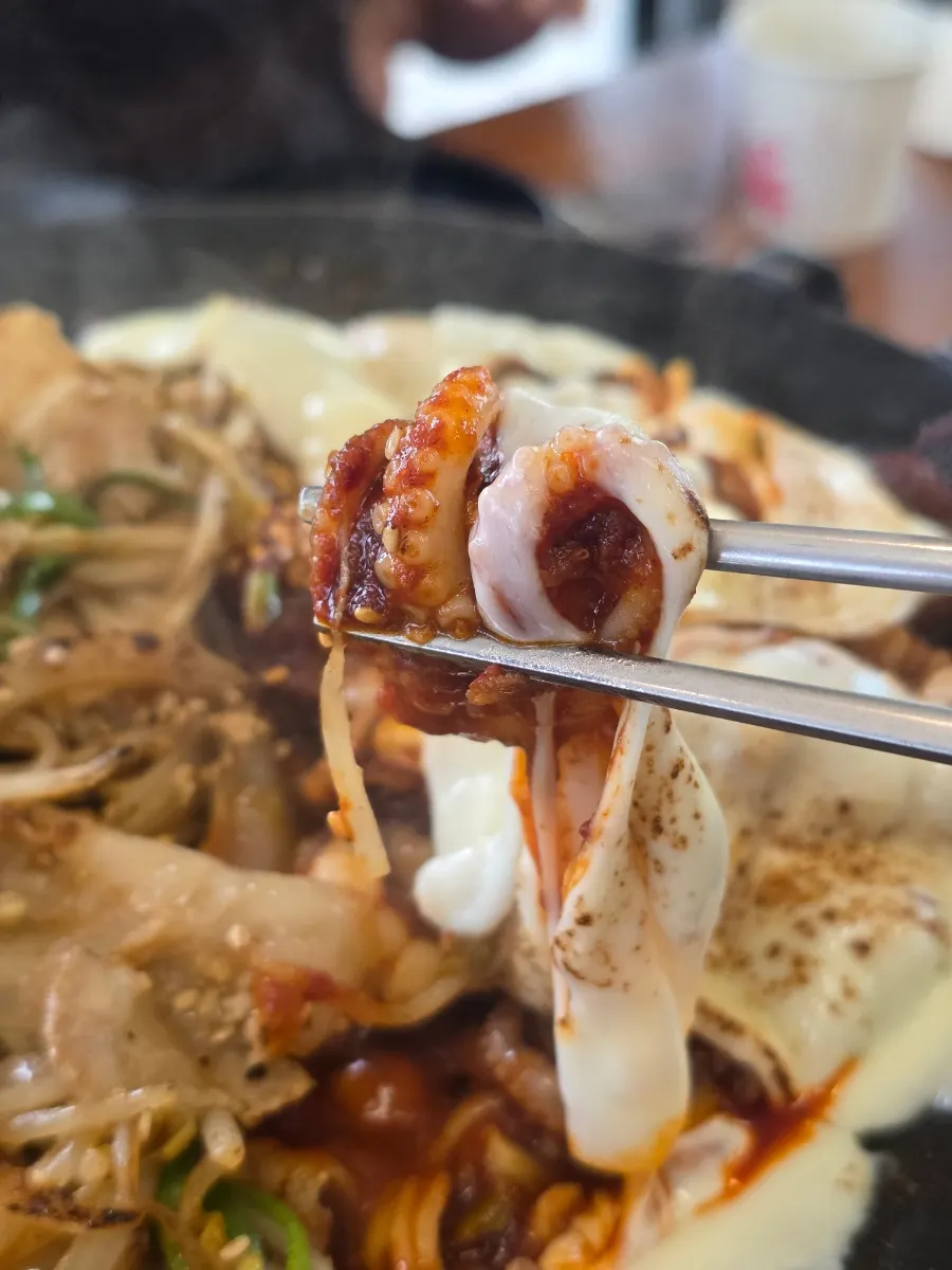 A piece of pork belly coated in sauce