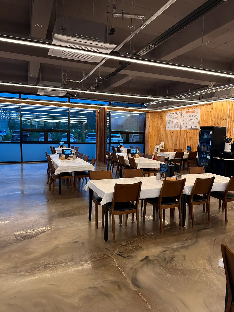 Dining hall seating with generous spacing between tables