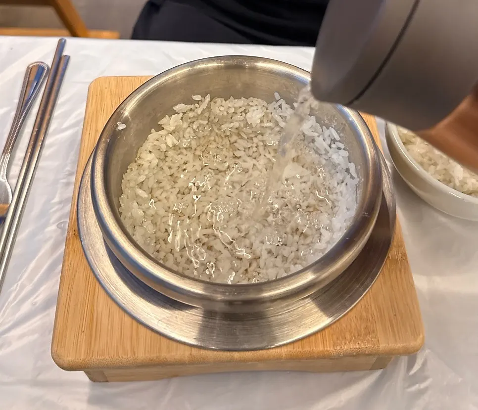 Pot rice scorched-rice crust after scooping out rice and adding water