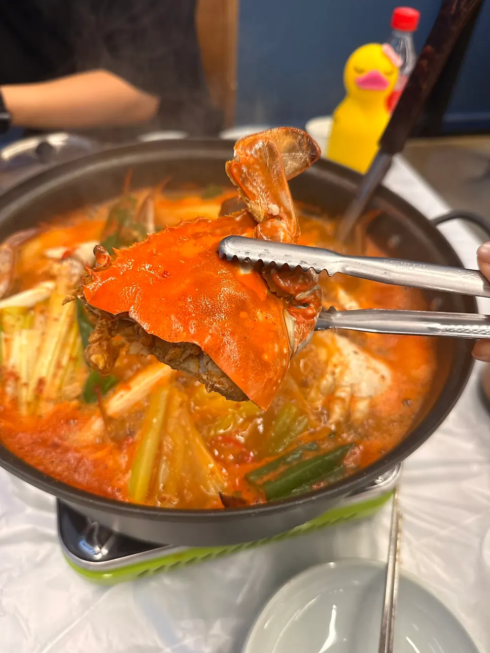 Crab soup packed full of halved crabs