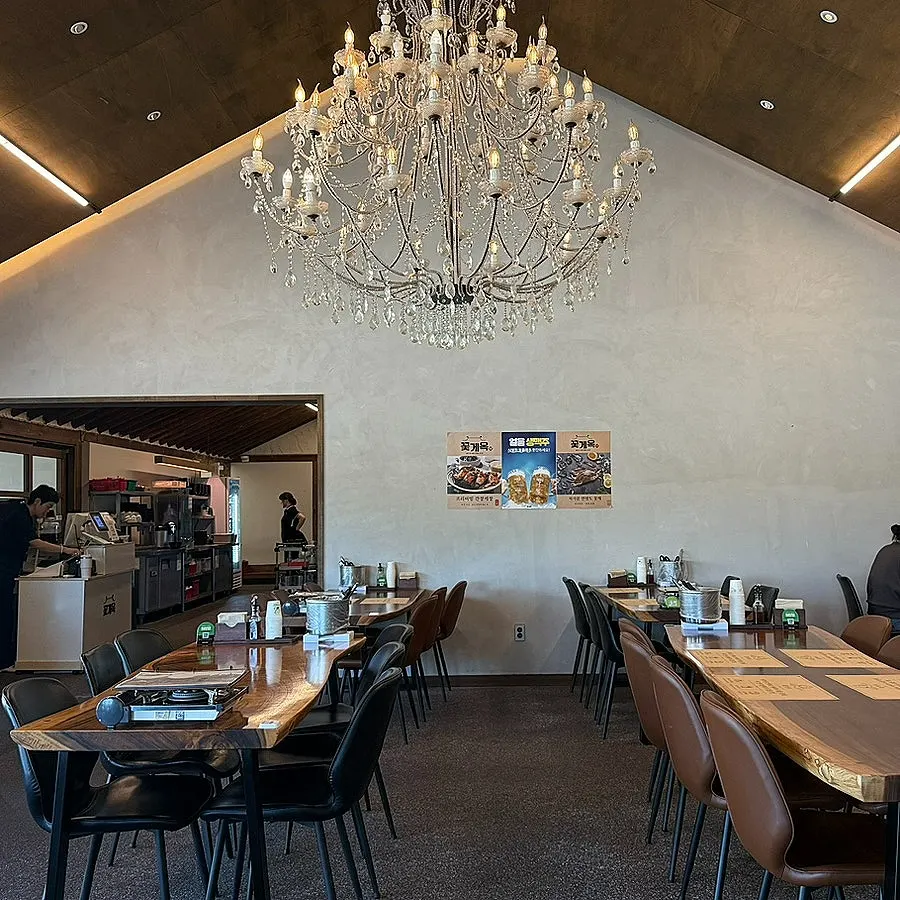 Wooden-table dining area in Kkotgeok's main building