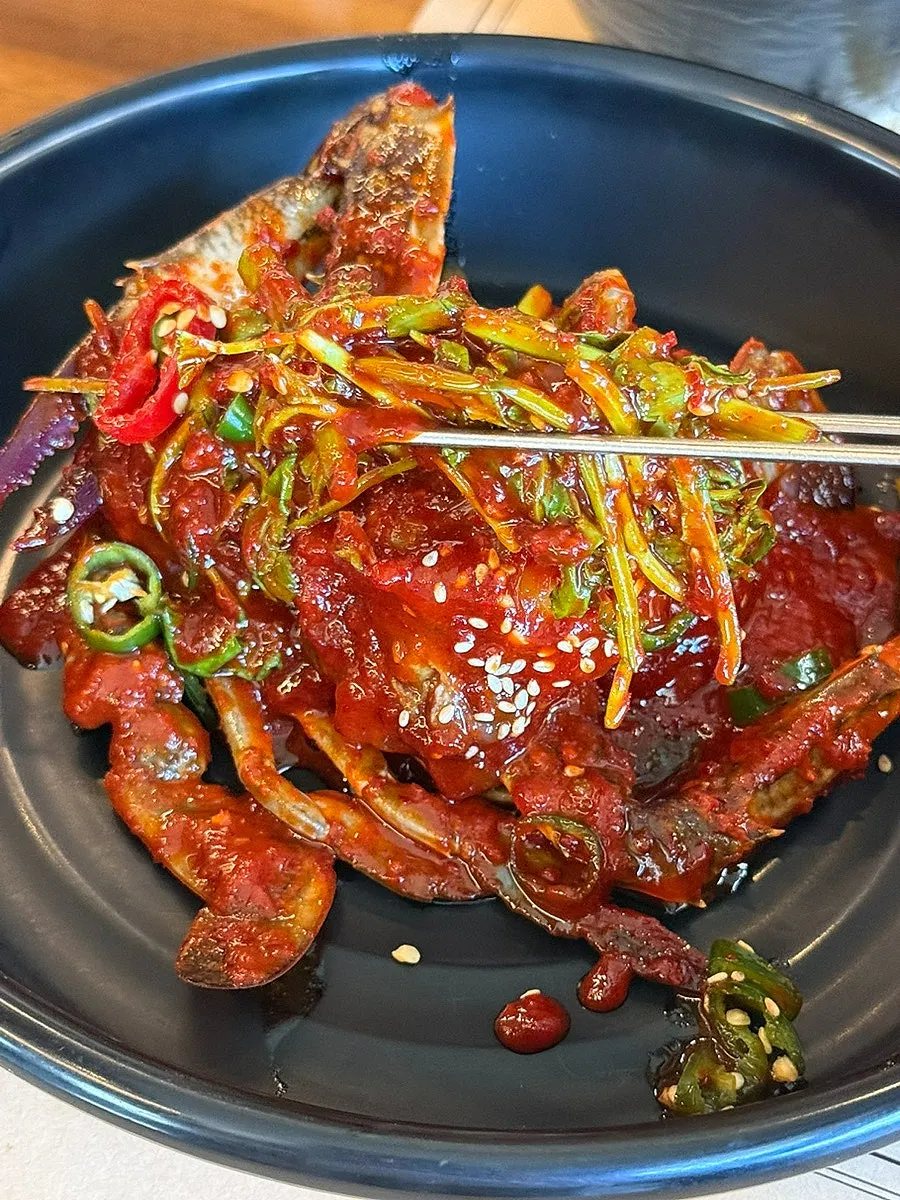 Minari served with spicy marinated crab