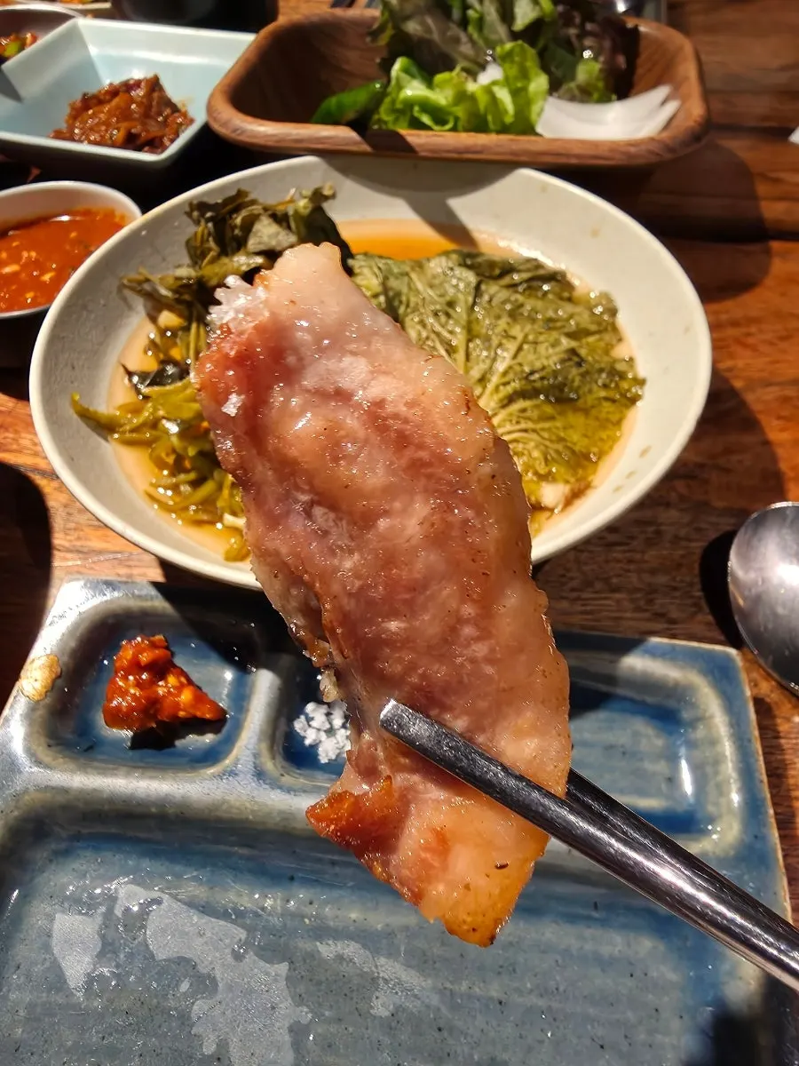 A piece of snowflake pork jowl topped with wasabi