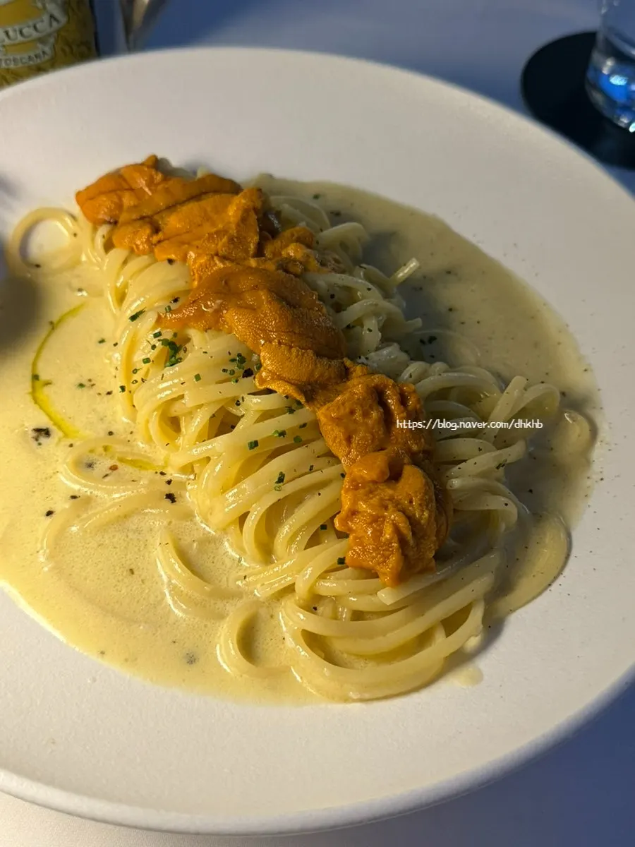 Uni pasta topped with sea urchin