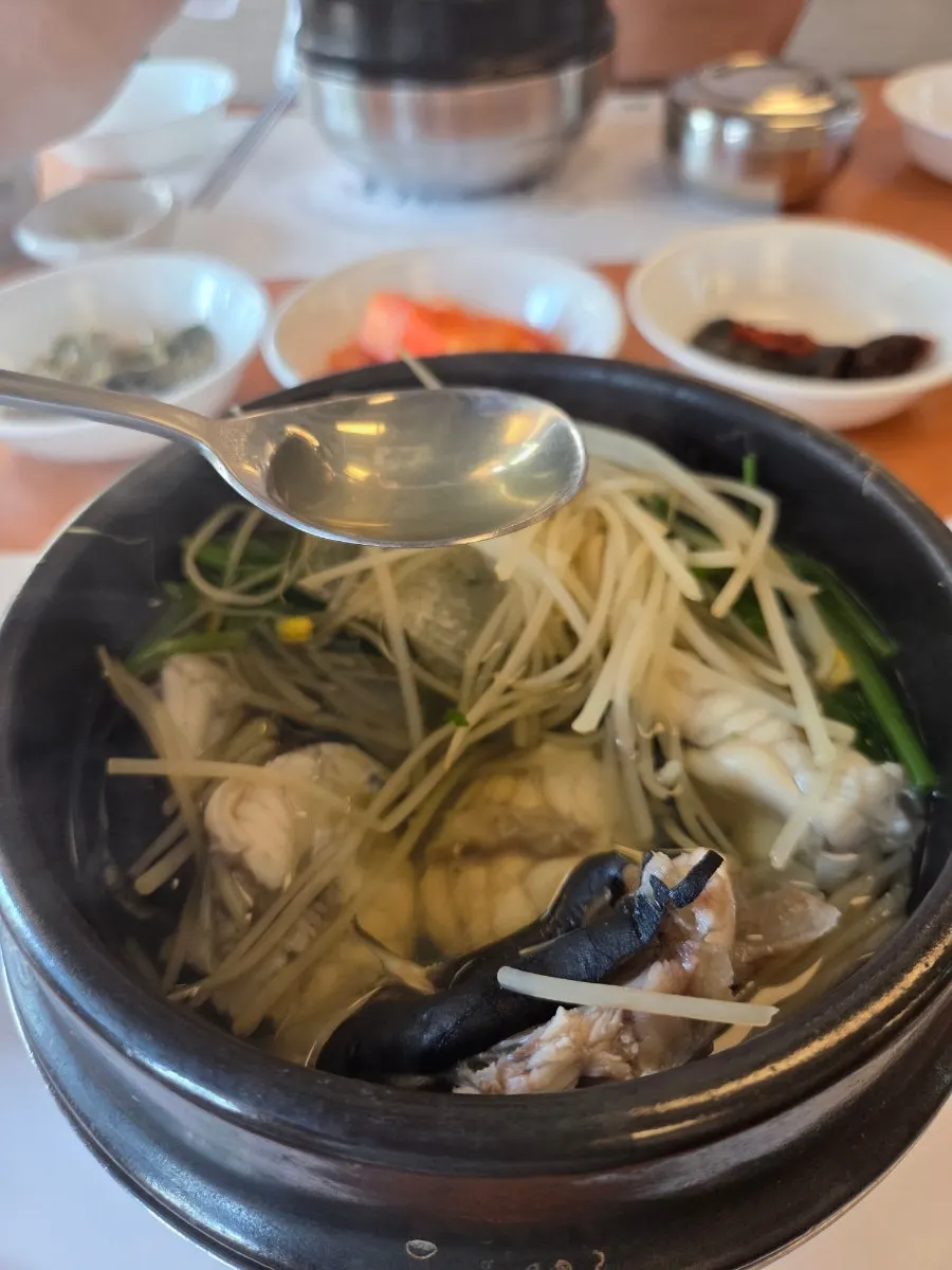 Spoonful of pufferfish meat with minari