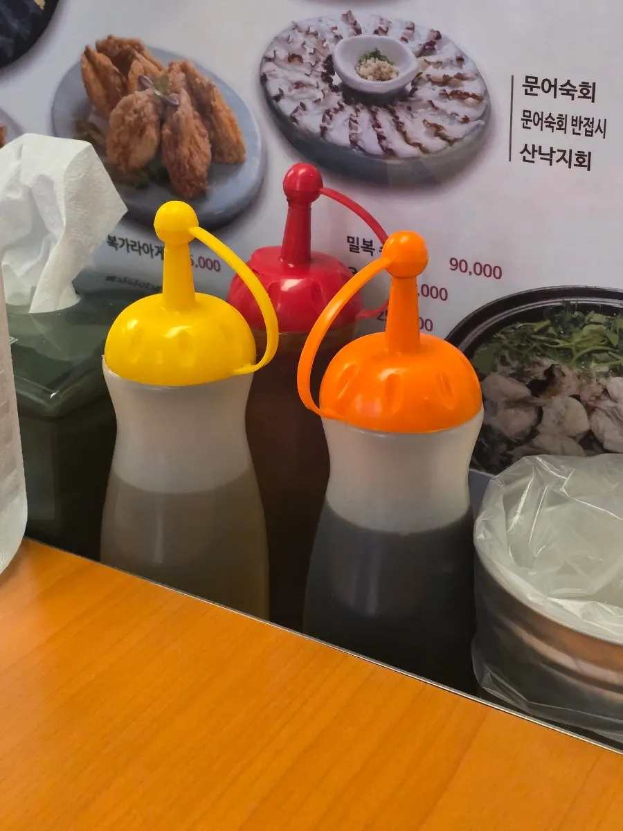Vertical photo of a steaming pot of pufferfish soup