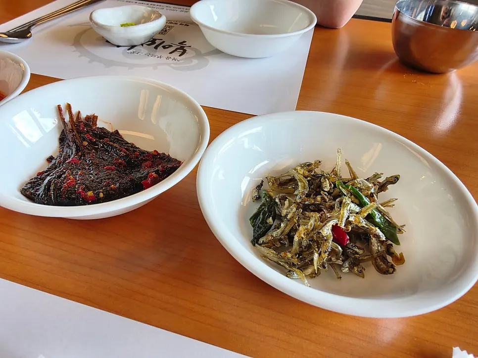 Banchan spread with kimchi, anchovies, and pickled vegetables