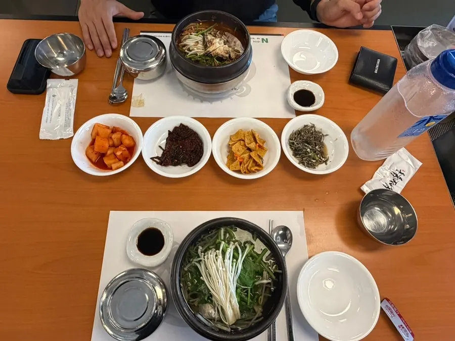 Clear and spicy pufferfish soups served together on the table