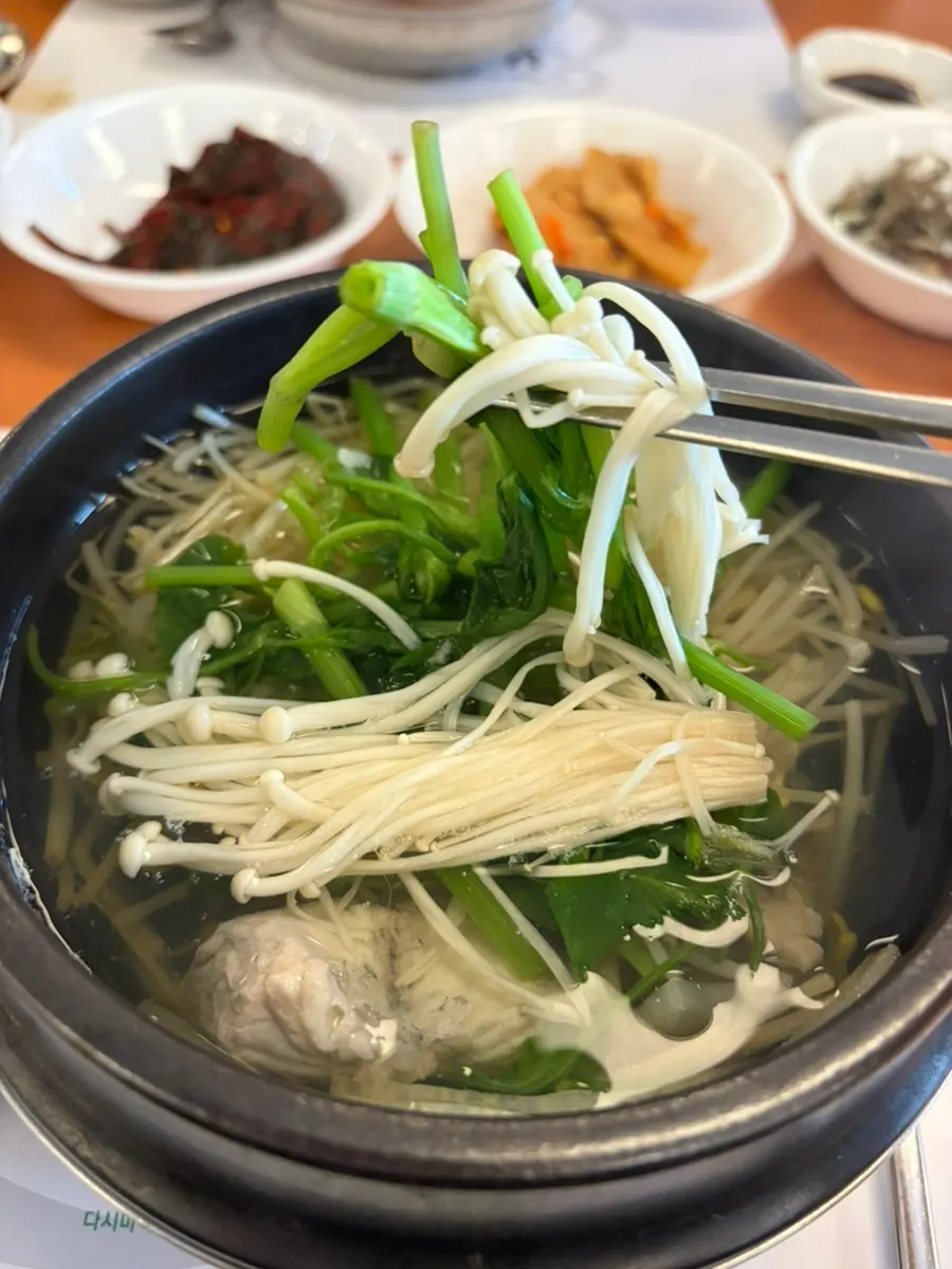 Pufferfish skin and meat lifted out of the soup