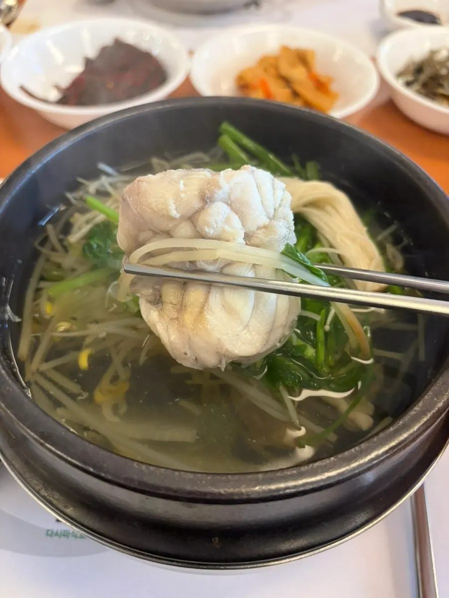 Broth full of minari and bean sprouts