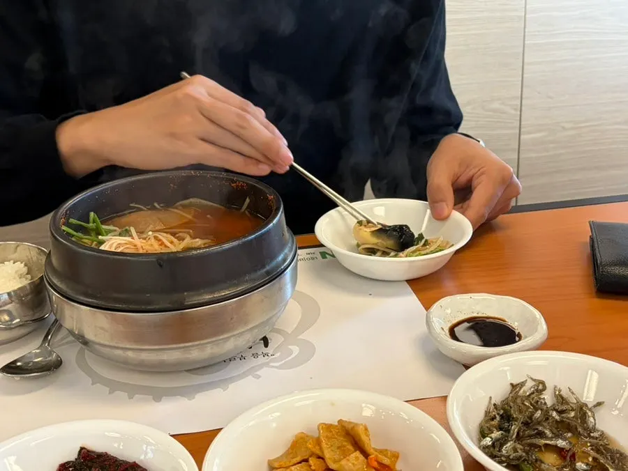 A spoonful of rice mixed into the pufferfish soup