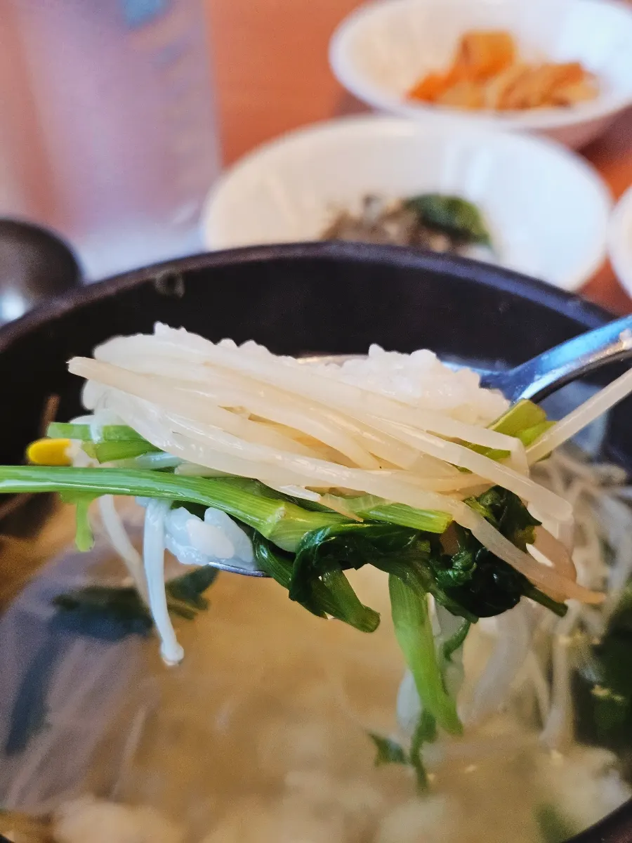 A finished bowl of milbok jiri with rice added