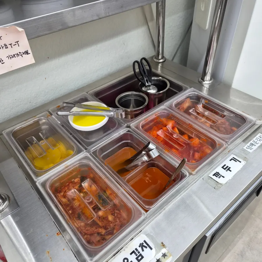 Interior of Cheongdam Dak Kalguksu packed with weekend lunch customers