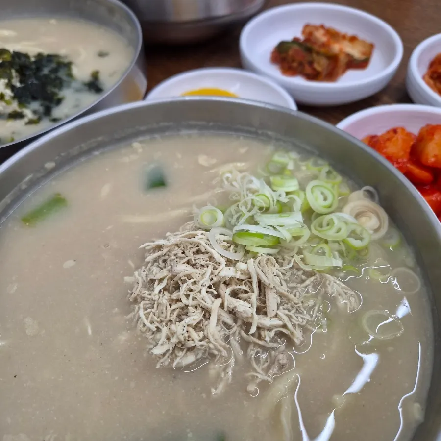 Three bowls of chicken kalguksu set on the table