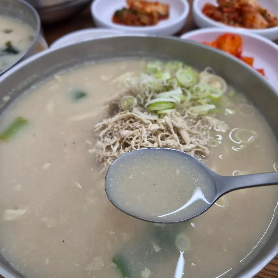 A bowl of basic chicken kalguksu with chicken pieces