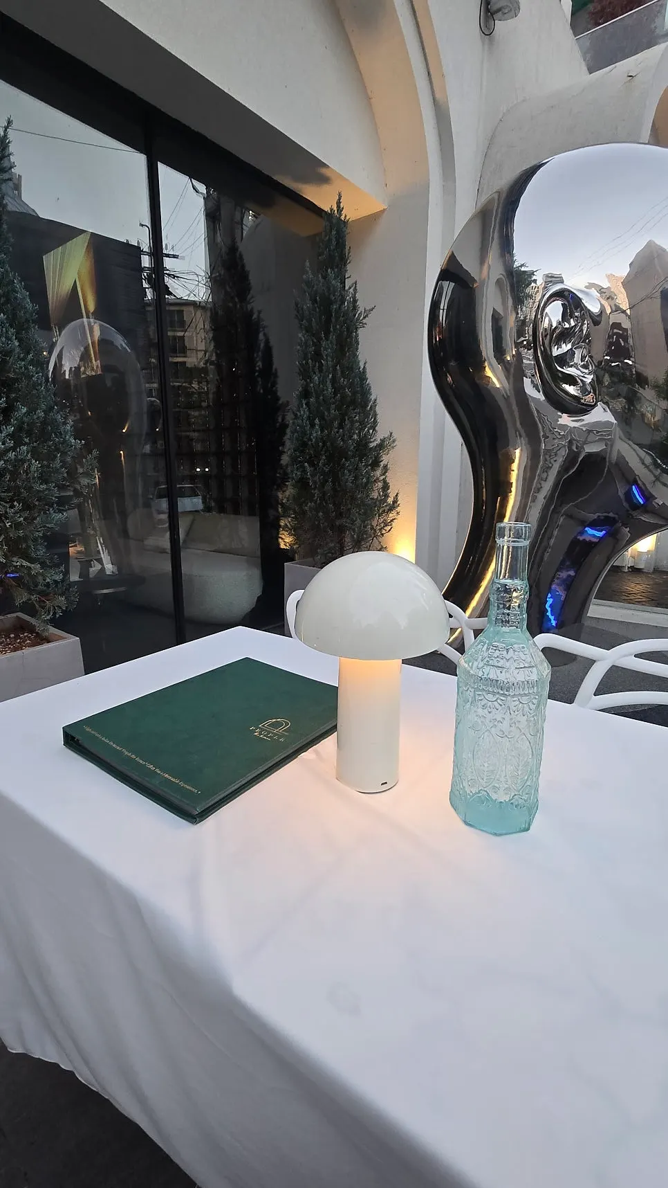 Terrace seating with lights and sculptures