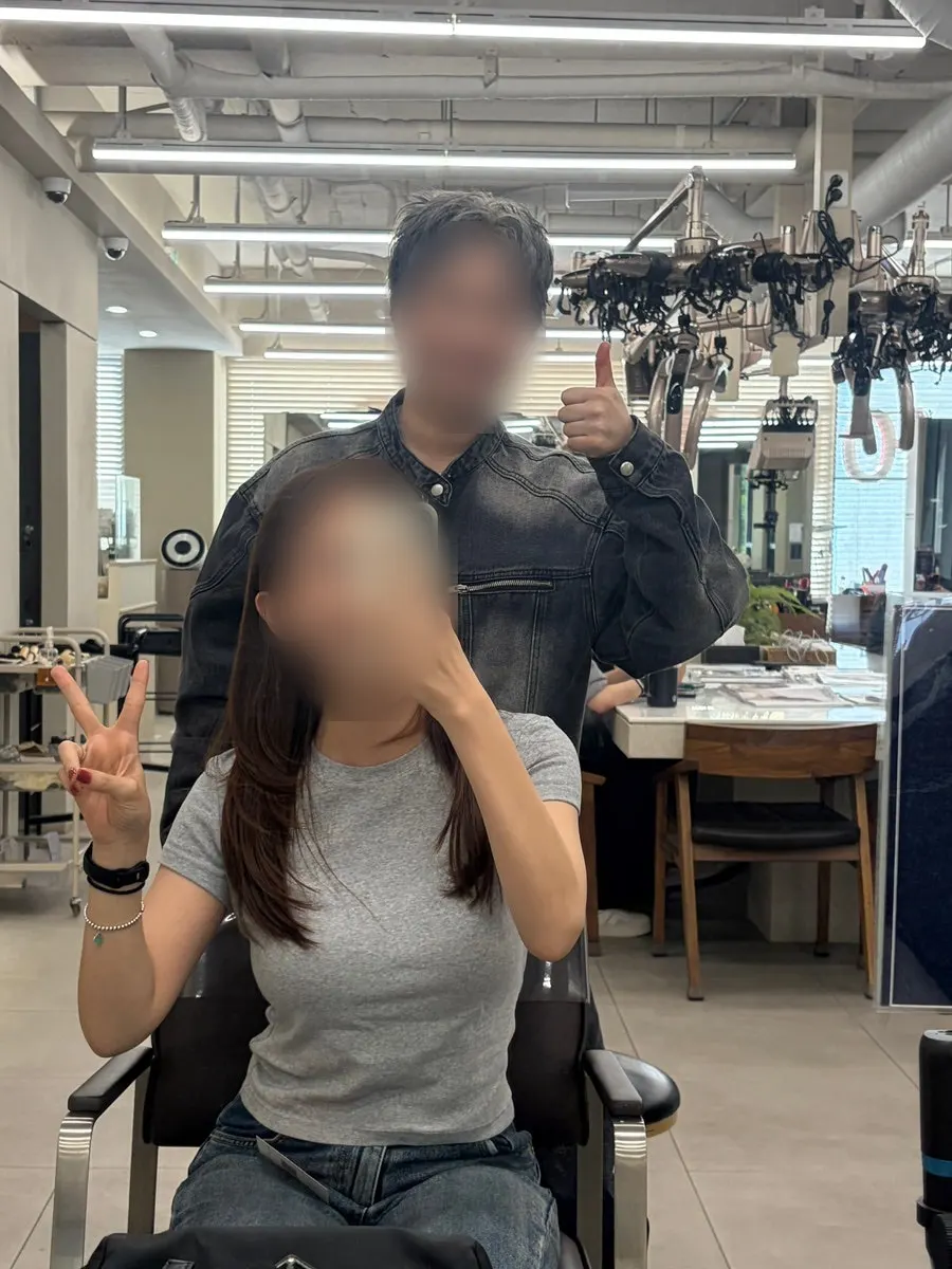 Finished style in front of the mirror after the treatment