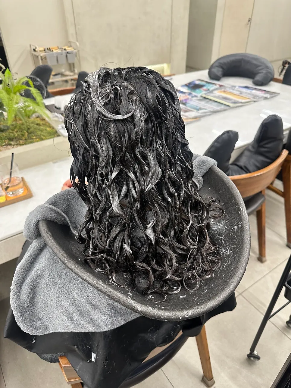 Side view showing revived root volume in the hippie perm