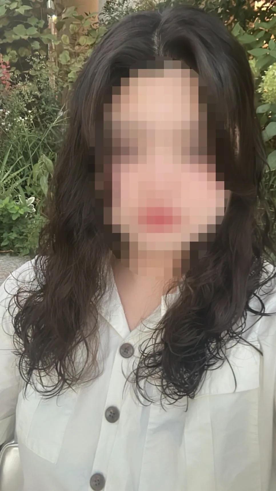 Full-body shot showing the overall length and waves of the hippie perm