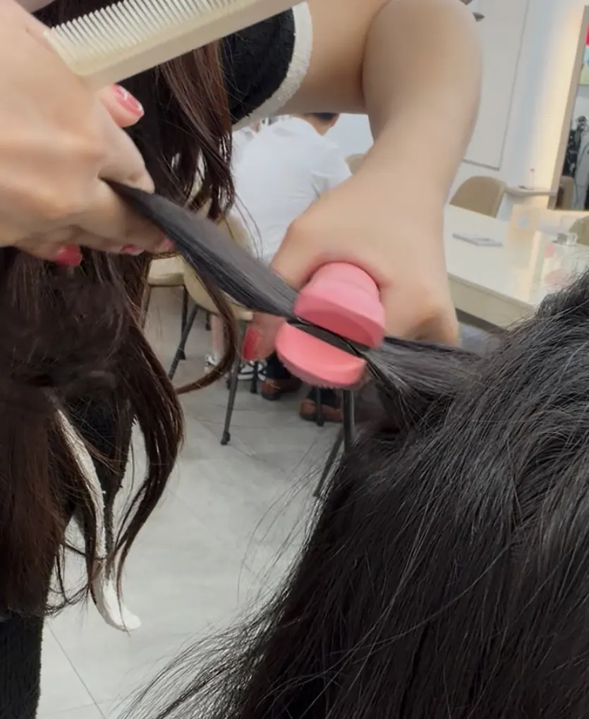 Iron root perm being applied section by section