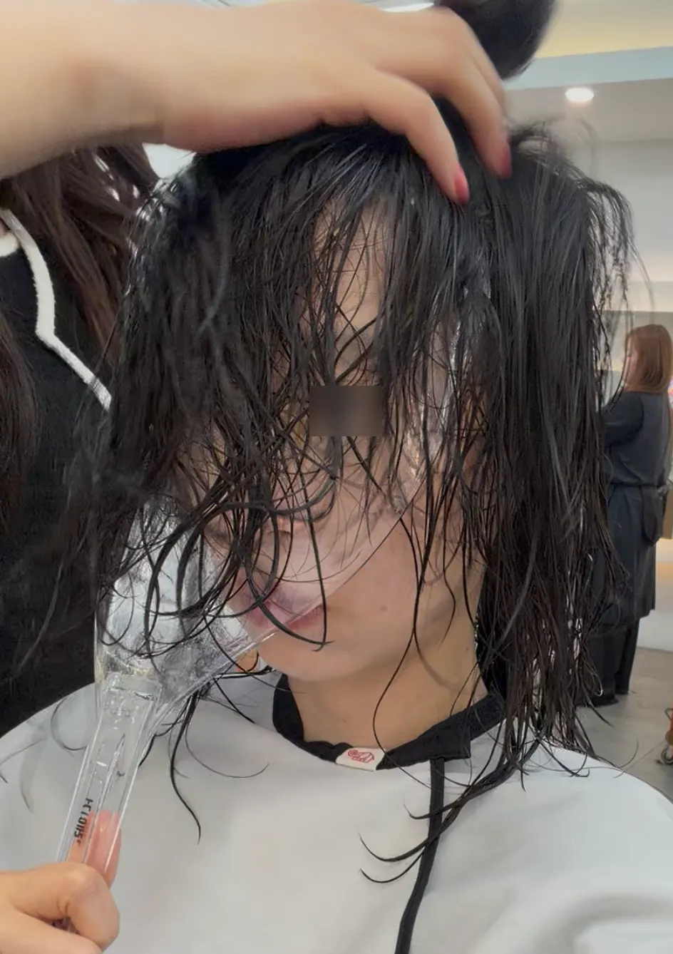 Finishing the ends with a flat iron during the treatment