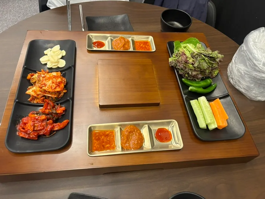 Menu board listing jokbal and side dishes