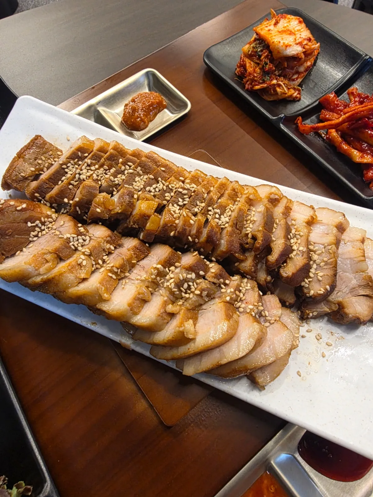 Tender bossam table setting at Cheongdam Jokbal Gwanggyo Sanghyeon Branch