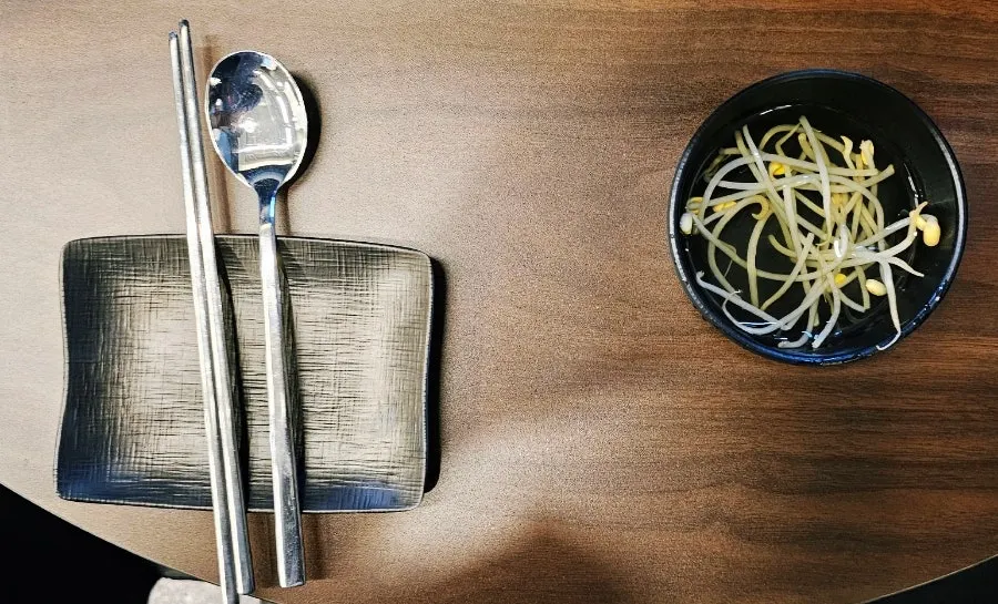 Table set with utensils and side dishes