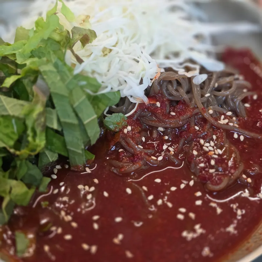 A bowl of bibim makguksu served as a free extra