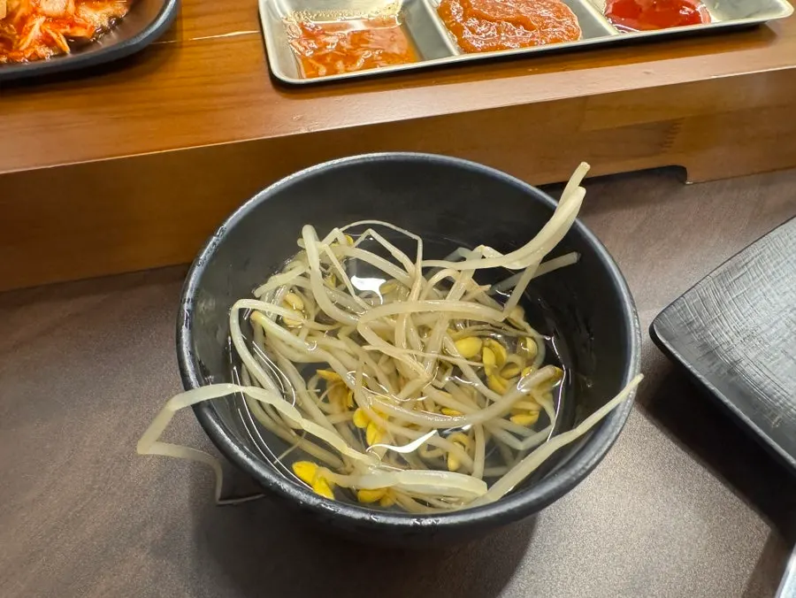 Table set with basic side dishes and bean sprout soup