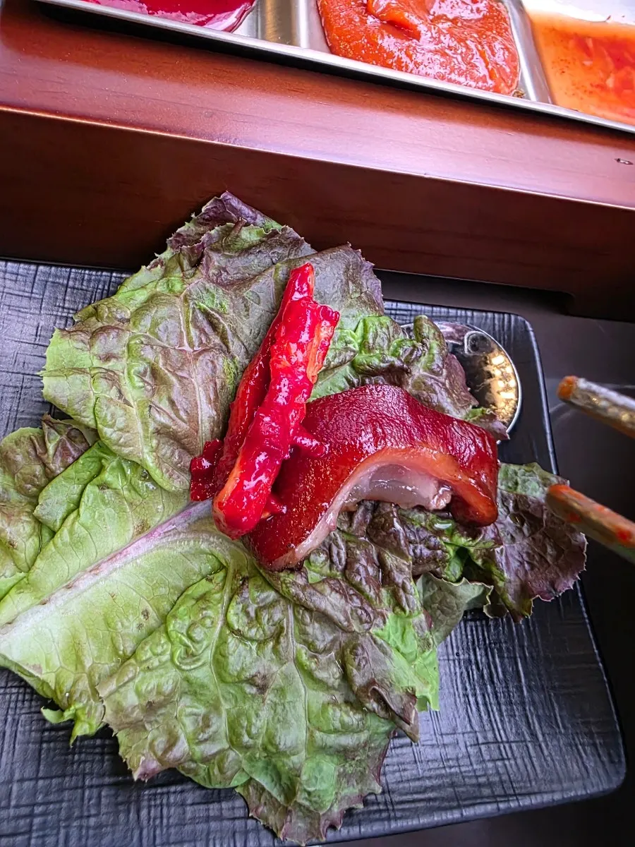 A piece of jokbal dipped in ssamjang