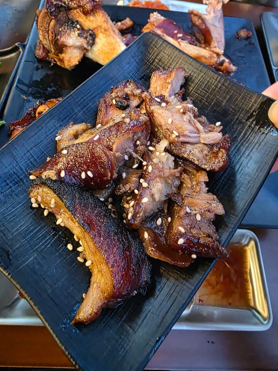 Free BBQ flame-grilled salted pork given as service