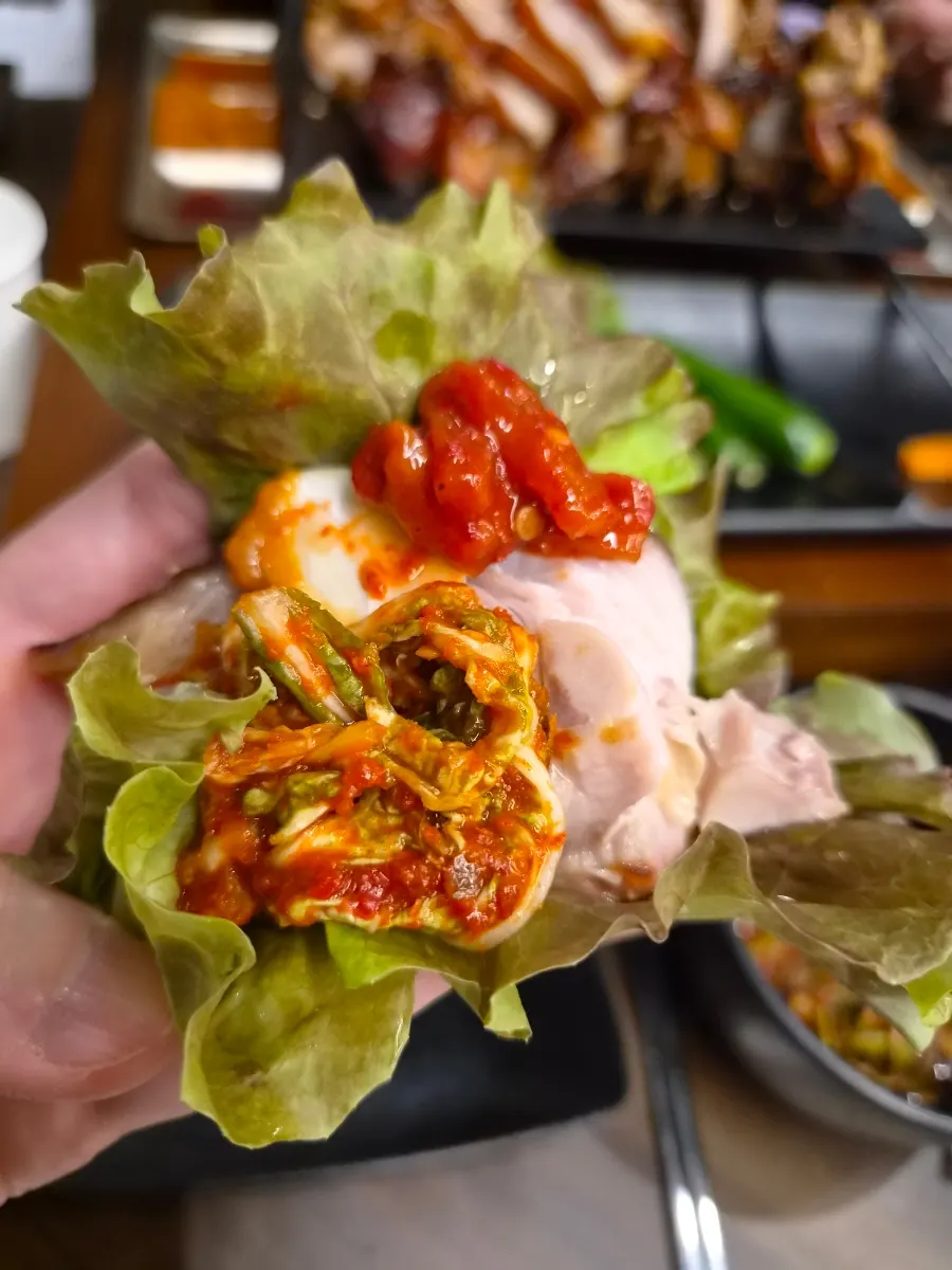 A piece of jokbal paired with makguksu