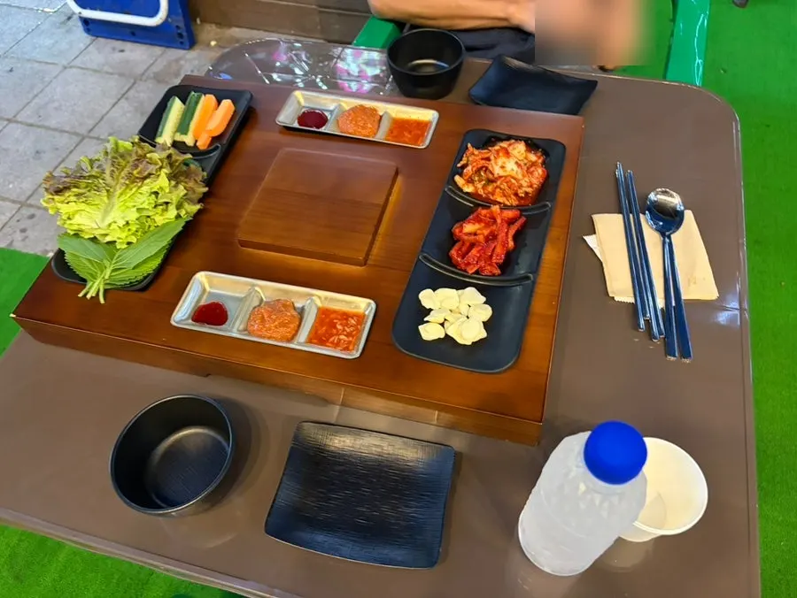 Wooden table carved to fit the shape of each dish