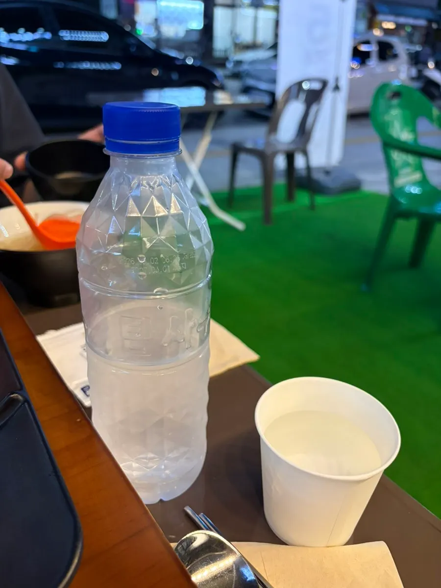 Bottled water and the table spread