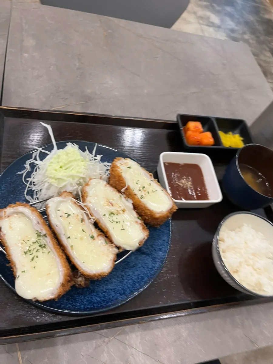 Cross-section of the cheese cutlet full of mozzarella
