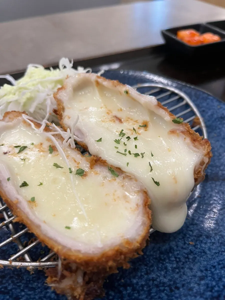 Close-up of a piece of cheese cutlet