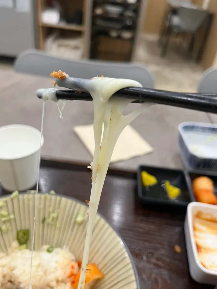 Contrast between the crunchy exterior and soft cheese interior